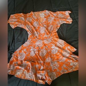 Light blue and orange romper , stretchy, fits sizes 14-18 roughly.